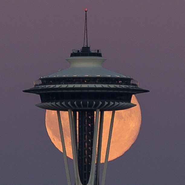 full moon over Seattle Space Needle